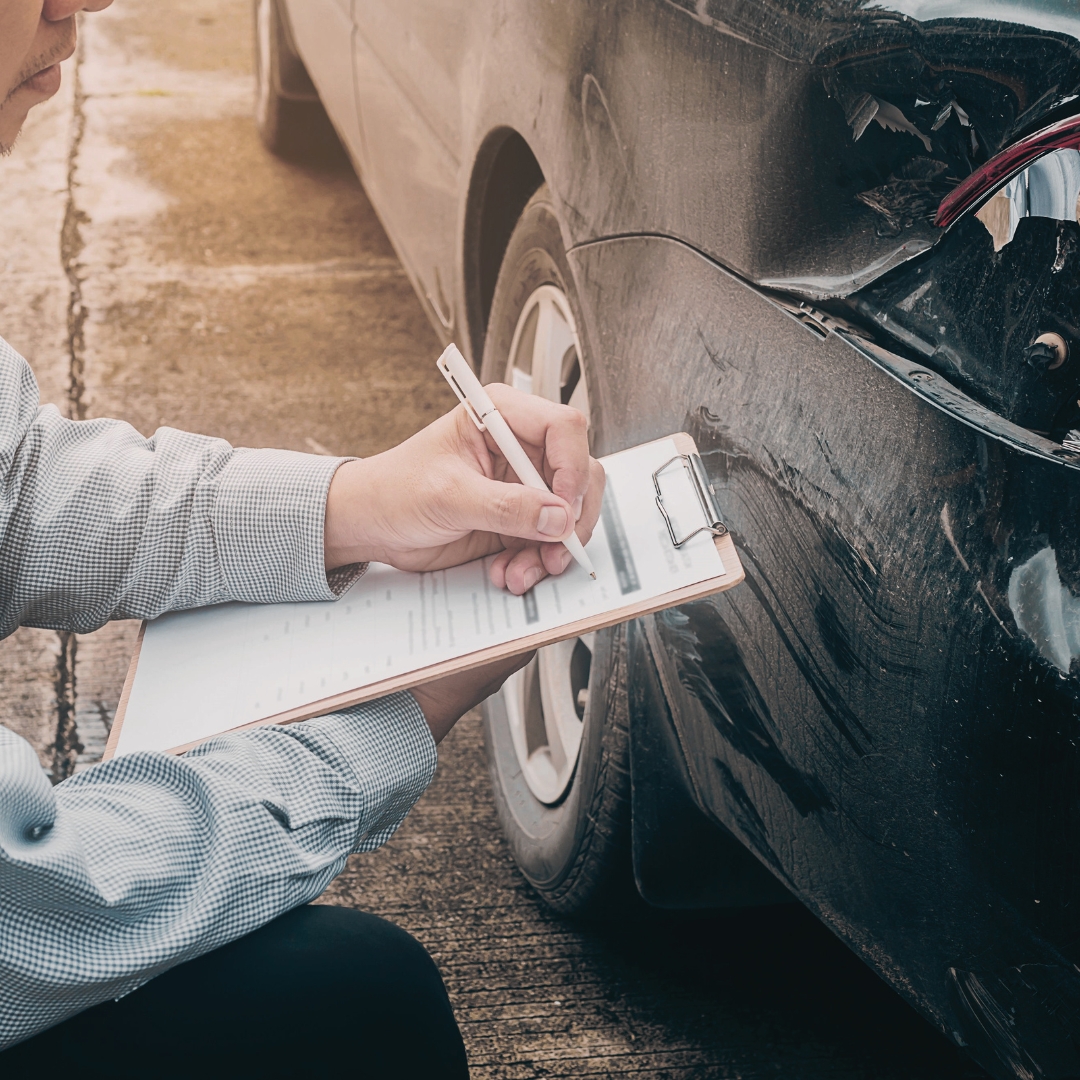 Agent and customer signing an auto insurance policy